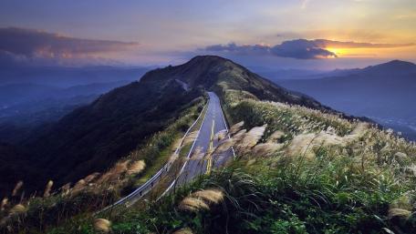 Serene Mountain Road at Dusk wallpaper