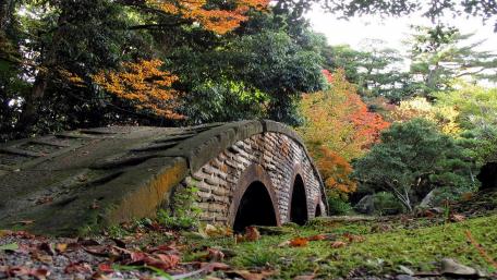 Serene Autumn Bridge in Nature's Embrace wallpaper