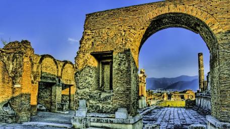 The Triumphal arch of Tiberius at the entrance to the Forum of Pompeii wallpaper