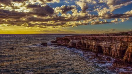 Majestic Cliffs at Sunset over the Sea wallpaper