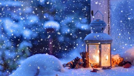 Snowy Christmas Lantern by a Window wallpaper