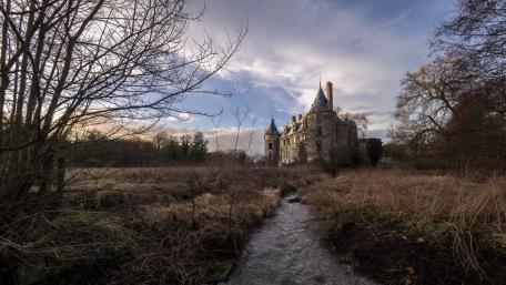 Abandoned Castle Surrounded by Nature's Serenity wallpaper