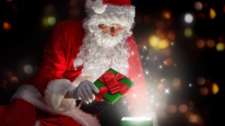 Santa Claus opening gift wallpaper