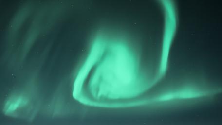 Majestic Northern Lights Dancing in the Night Sky wallpaper