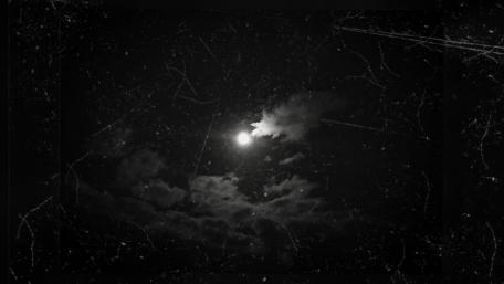 Moon among the clouds wallpaper