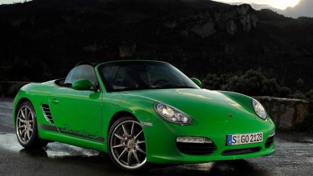 Vibrant Porsche Boxster on a Scenic Road wallpaper