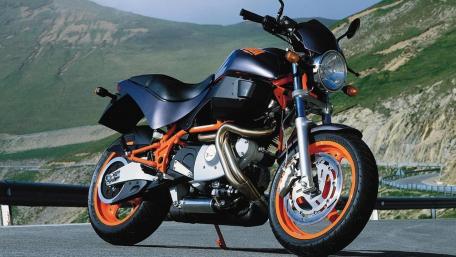 Sleek Motorcycle Against Scenic Landscape wallpaper