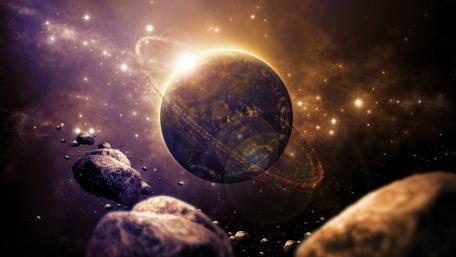Majestic Ringed Planet Amidst Cosmic Debris wallpaper