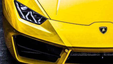 Vibrant Yellow Lamborghini Close-Up Wallpaper wallpaper