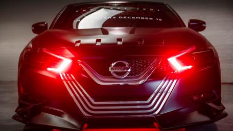 Red Nissan Headlamp with Dynamic Design Showcase wallpaper