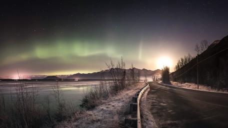 Mesmerizing Aurora Borealis Road Scene wallpaper