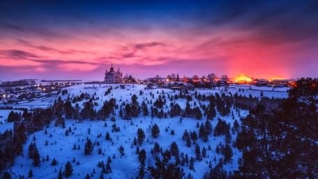 Winter Wonderland Over Snowy Cityscape wallpaper