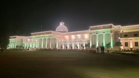 Elegant Building Illuminated at Night Displaying City Beauty wallpaper