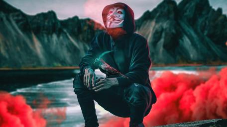 Mysterious Figure Amidst Crimson Mist wallpaper