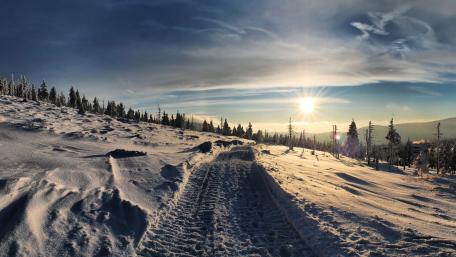 Winter Wonderland Roadway Serenity Above Snowy Landscape wallpaper