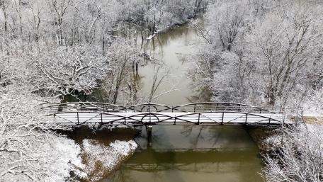 Winter Wonderland with Bridge Over Serene River wallpaper