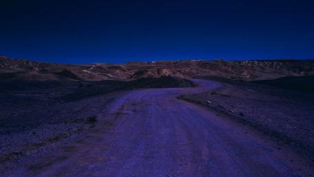 Winding Road Under Starry Night Sky wallpaper