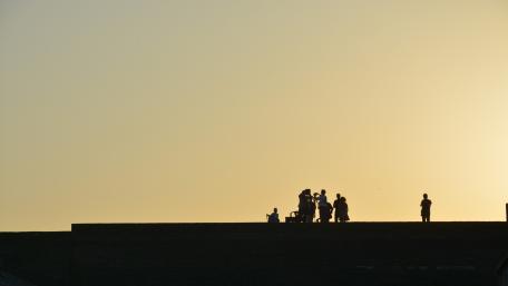 Sunset Rooftop Gathering Silhouette wallpaper
