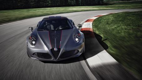 Sleek Sports Car Racing Around a Curve wallpaper