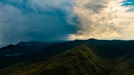 Majestic Mountains Under Dramatic Clouds wallpaper