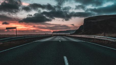 Endless Road Under a Dramatic Sky wallpaper