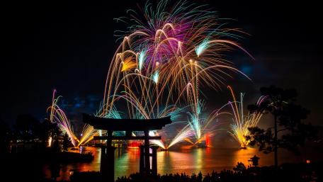 Vibrant Fireworks Over Torii Gate Celebration wallpaper