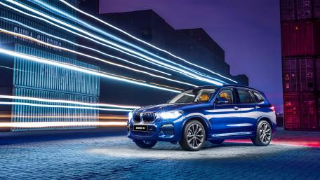 Dynamic BMW X3 in Vibrant Night Lights wallpaper