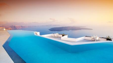 Tranquil Infinity Pool Overlooking Serene Waters wallpaper