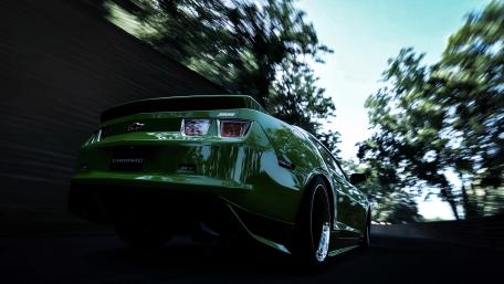 Thrilling Speed of a Green Camaro wallpaper