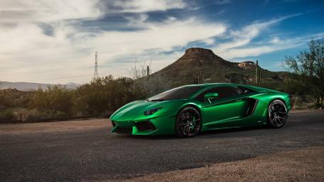 Electric Green Lamborghini Aventador on Scenic Roadway wallpaper