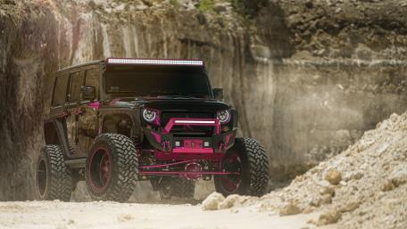 Vibrant Jeep Wrangler in Rugged Terrain wallpaper