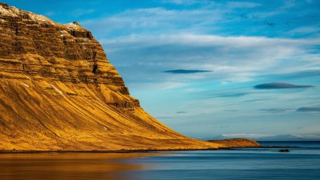 Majestic Cliffside at the Shoreline in 5K Resolution wallpaper