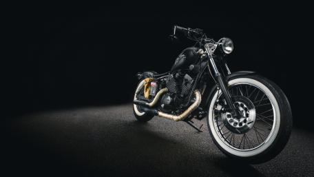 Sleek Black Motorcycle on Dark Background wallpaper