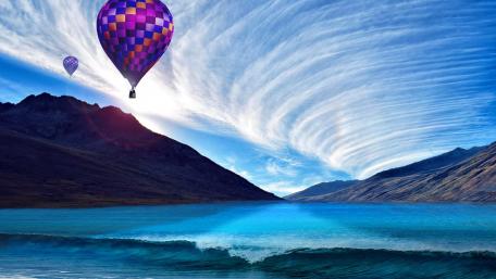 Soaring Above Waves and Mountains wallpaper