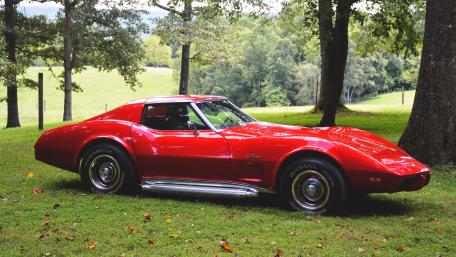 Classic Red Sports Car in Nature wallpaper