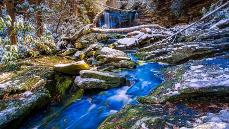 Serene Autumn Waterfall Scene in Nature wallpaper