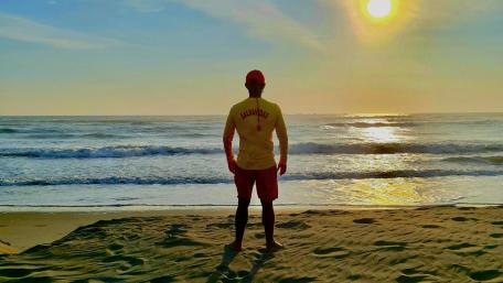 Attentive lifeguard on the beach wallpaper