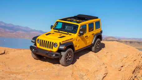 Vibrant Yellow Jeep Wrangler Rubicon in Nature's Playground wallpaper