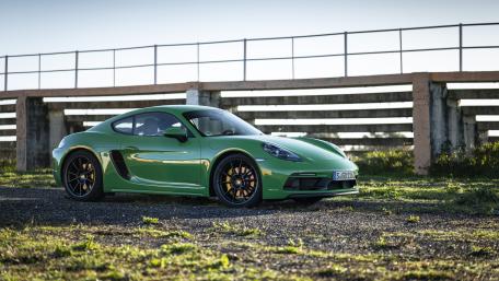 Sleek Green Porsche 718 Cayman Wallpaper wallpaper