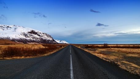 Endless Road Through Scenic Steppe Landscape wallpaper