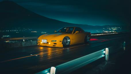 Yellow Mazda RX-7 at Night on Highway wallpaper