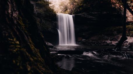 Serenity of a Cascading Waterfall in Nature wallpaper