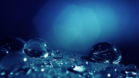 Serene Blue Waterdrops on Abstract Surface wallpaper