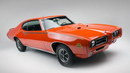 Classic Pontiac GTO Judge in Vibrant Orange wallpaper