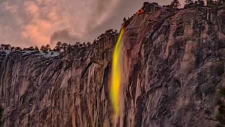 Golden Glow of a Majestic Waterfall wallpaper