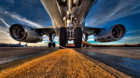 Majestic View of Airplane Wheels on Runway wallpaper