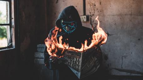 Burning newspaper wallpaper