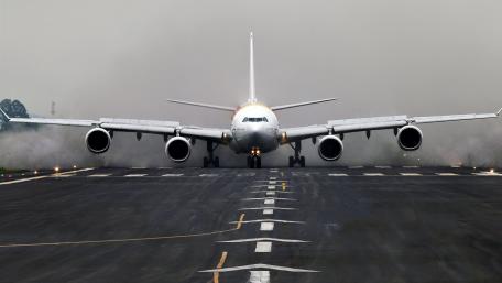 Powerful Jetliner on Runway Final Approach wallpaper