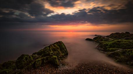 Serene Dusk Over Tranquil Sea Shore wallpaper