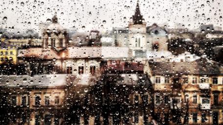 Rainy Cityscape Through a Glass Window wallpaper